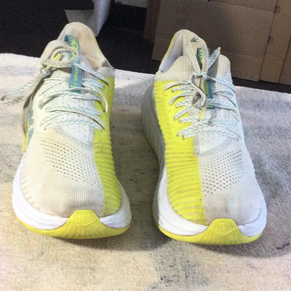 White and Yellow Athletic Shoes